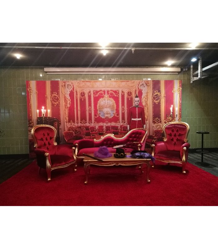 Red and gold baroque chaise lounge in a photo backdrop setup with armchairs, baroque furniture rental by 126 Events
