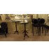 Chaise de bar velours noir médaillon assise 76 cm avec table haute et fauteuil assorti dans un bar