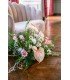 Close-up of the Ecru Shell Sofa for Wedding Rental with a Flower Bouquet