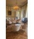 2-seater rounded ecru shell sofa in a château room for a reception
