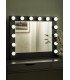 White LED makeup mirror on a light wood console table in an event dressing room