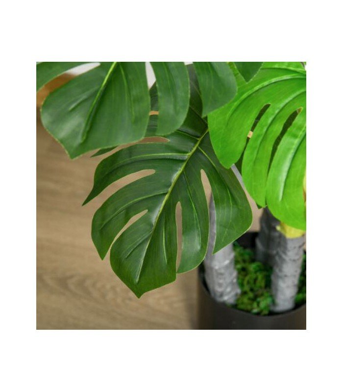 Zoom sur le feuillage du bananier monstera artificiel, décor végétal exotique à louer chez 126 Events