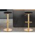 Two adjustable black and gold high stools in an elegant living room