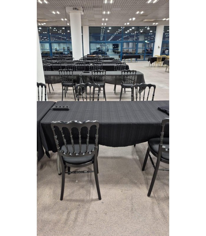 Photo of the black Napoleon III chair at a conference, chair rented from 126 Events