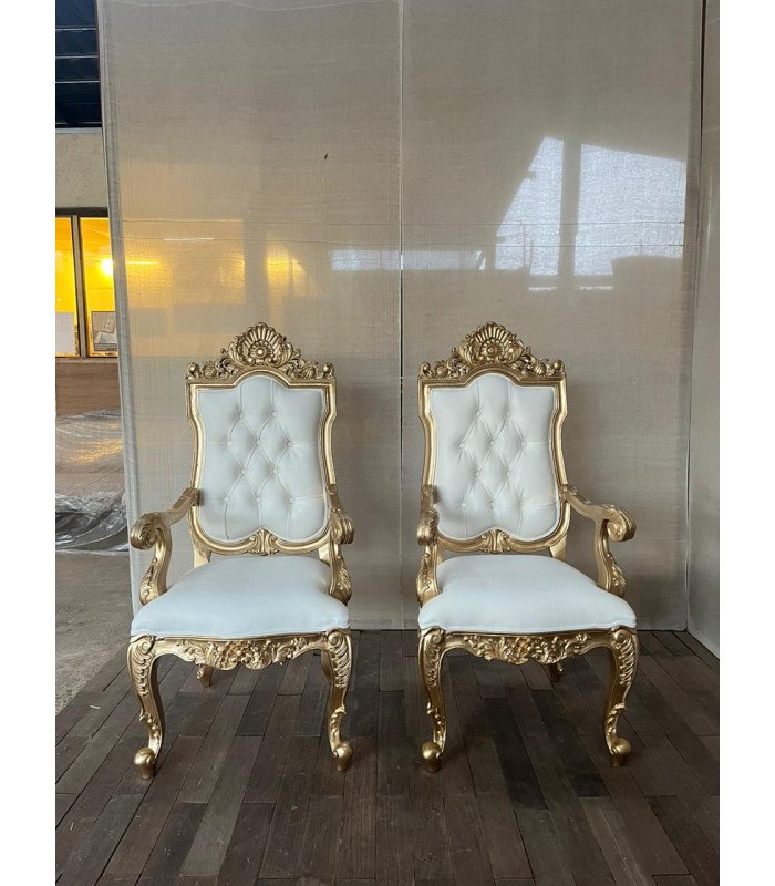 Photo of two white and gold faux leather baroque armchairs in a glass-enclosed room, available for rent from 126 Events.
