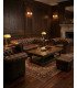 Pack 1 canapé et 2 fauteuils Chesterfield en cuir marron installé dans un salon événementiel avec tapis, table basse et pouf