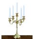 Shiny gold 5-branch candlestick, height 40 cm, placed on a piece of furniture, lighting accessory for a reception table in Paris