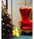Golden and red princess throne next to a Christmas tree under a Merry Christmas sign