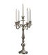 Silver 5-branch candlestick, height 50 cm, placed on a reception table.