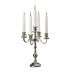 Silver 5-branch candelabra, 35 cm high, placed on a reception table.