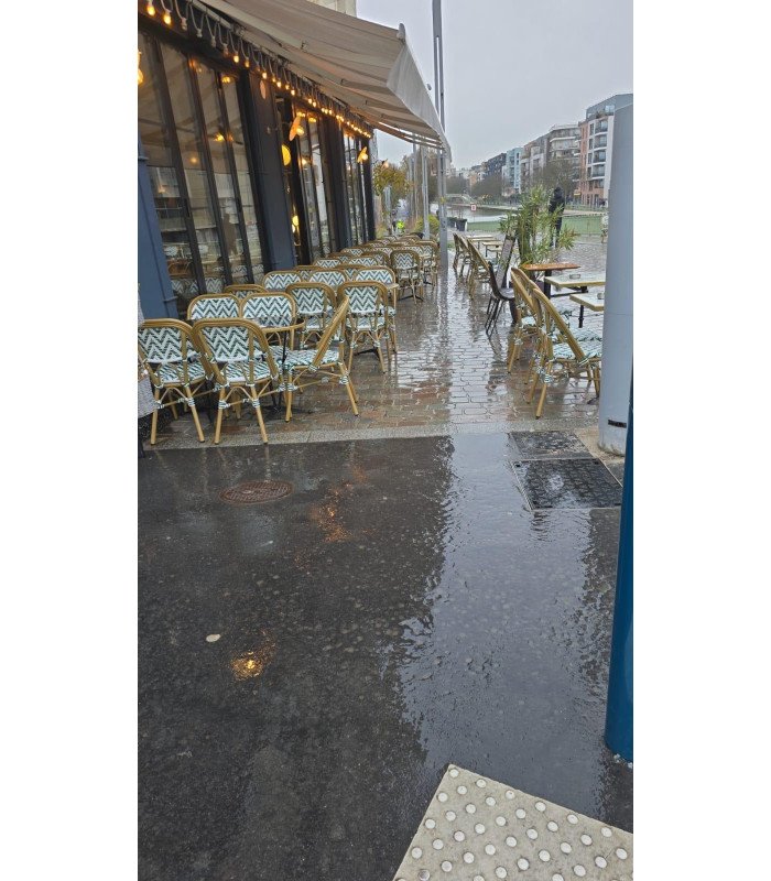 Green and white woven bistro chair