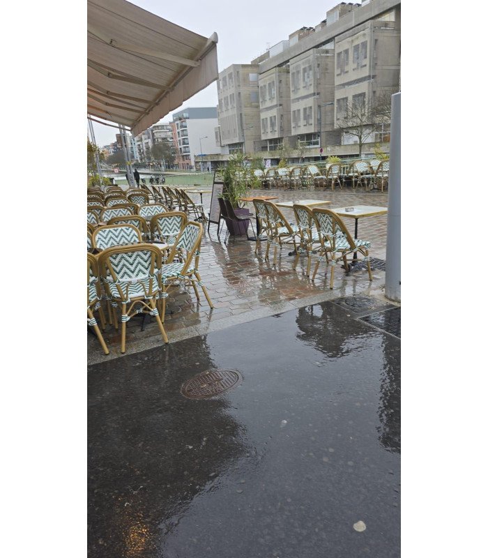 Green and white woven bistro chair