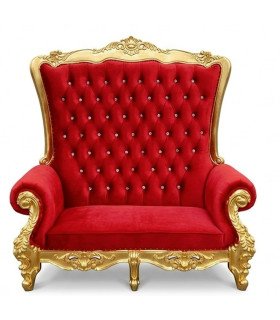 Red and gold two-seater baroque throne sofa, front view indoors, red velvet seat and gold frame