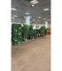 Artificial green partitions used to separate booths at a trade show