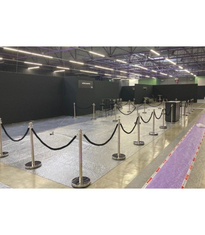 Set of silver bollards and black twisted rope