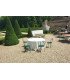 White, ornately molded reception sideboard installed in the courtyard of a castle