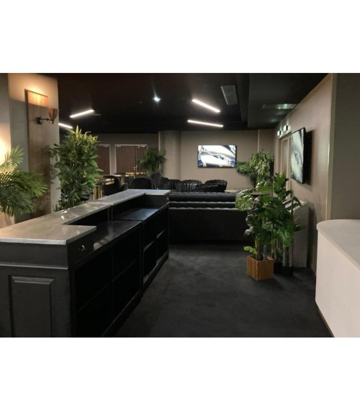 Green artificial bamboo used to decorate an event bar