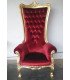 Red and gold Prince wedding throne in red velvet with gilded wooden frame.